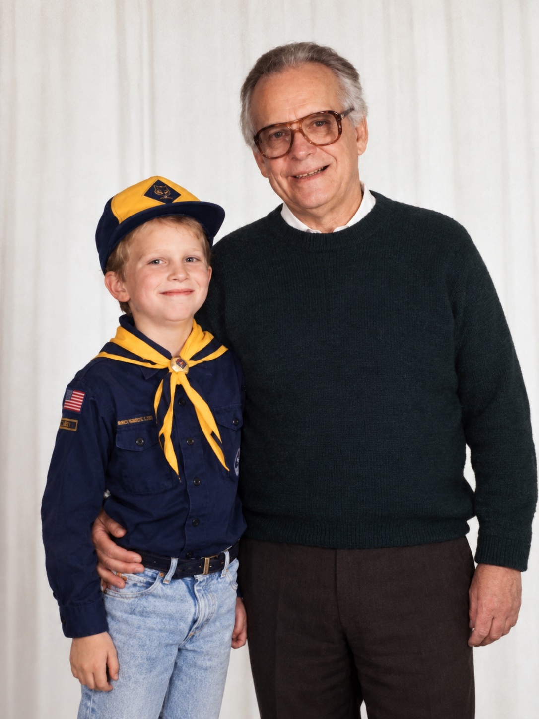 A young Ryan Yepsen in a Cub Scout uniform standing beside his grandfather, David Kendall